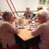 Beelden van de High Tea in de Oase